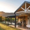 Verandah at Samara Karoo Lodge with outdoor dining setup, featuring scenic views