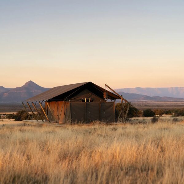 Exterior of a guest tent at Samara Plains Camp in the Karoo, with views of the surrounding plains